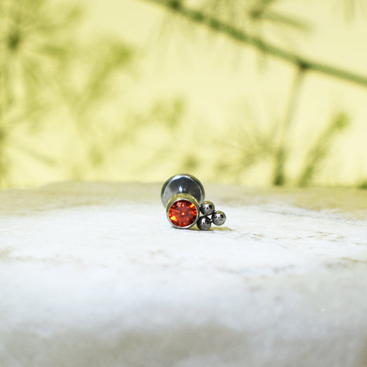 PIERCING LABRET BRILLO ROJO REDONDO ORNAMENTOS