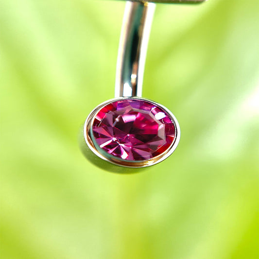 Piercing para ombligo con circón fucsia